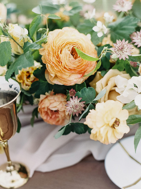 Orange ranunculus floral centerpiece Wedding &amp; Party