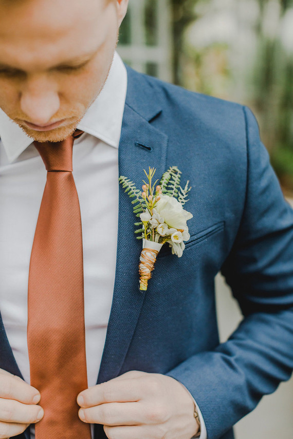 Blue groom's suit with copper tie