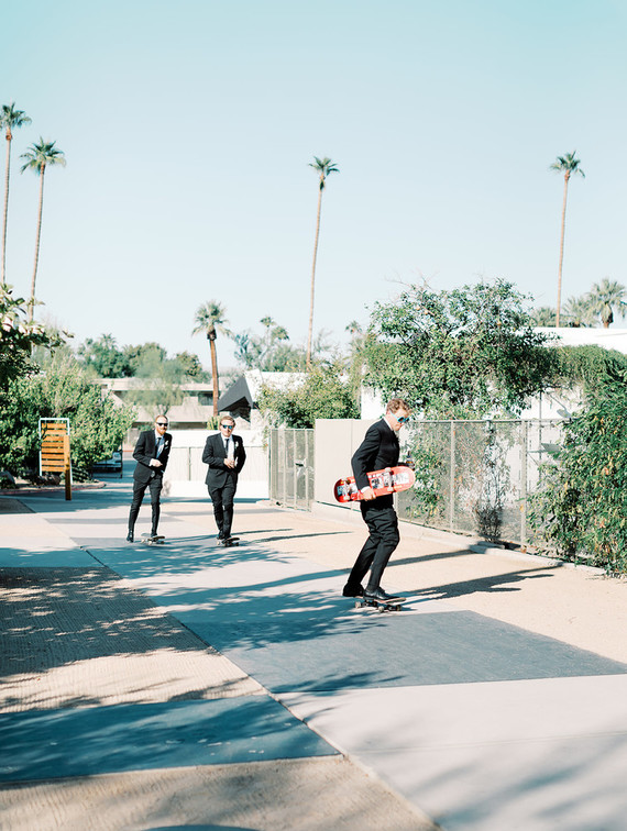 Groomsmen on skateboards